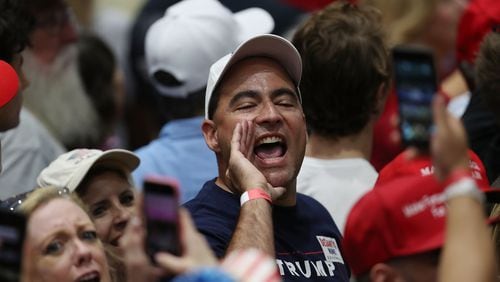 People yell at the news media as President Donald Trump talks about the press during a Wednesday campaign in Estero, Florida. President Trump continues travelling across America to help get the vote out for Republican candidates running for office. Joe Raedle/Getty Images