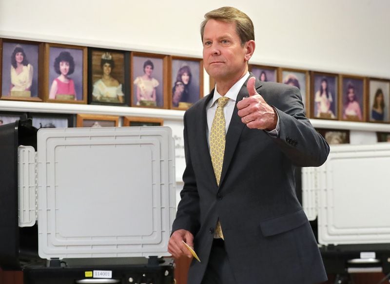 Secretary of State Brian Kemp gives a thumbs up after casting his ballot while voting with his wife Marty at the Winterville Train Depot in the runoff election on Tuesday, July 24, 2018, in Winterville. Kemp is in a runoff with Lt. Governor Casey Cagle after more than a year of bitter GOP infighting over who is the best conservative candidate for governor.   Curtis Compton/ccompton@ajc.com