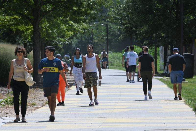 People walk along the beltline on in Atlanta. An AJC analysis shows there are heavy concentrations of  short-term rental properties are heavily clustered  near Midtown and the Beltline in northeast Atlanta and on the Westside around the Atlanta University Center and West End. There also are heavy concentrations. (Hyosub Shin / Hyosub.Shin@ajc.com)