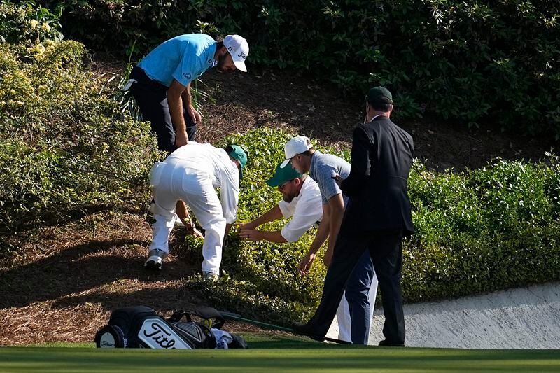 Max Homa looks for his ball on the 12th hole during final round at the Masters golf tournament at Augusta National Golf Club Sunday, April 14, 2024, in Augusta, Ga. (AP Photo/George Walker IV)