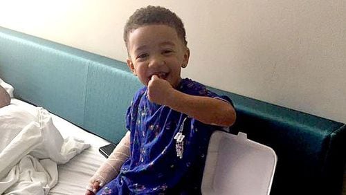 Lawrence Williams, the 3-year-old son of Megan Holmes, enjoyed Chinese food in his hospital room Friday, hours after getting shot in the back at a neighborhood cookout. (Family photo)