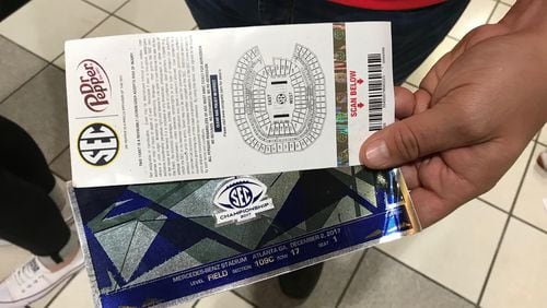 Counterfeit tickets remain a problem in college football. Georgia fans who drove to Atlanta Dec. 2 for the SEC championship game with Auburn bought these tickets for $300 each before finding out at the gate that they were fakes. College Football Playoff officials warn against buying printed tickets from scalpers. BO EMERSON / BEMERSON@AJC.COM