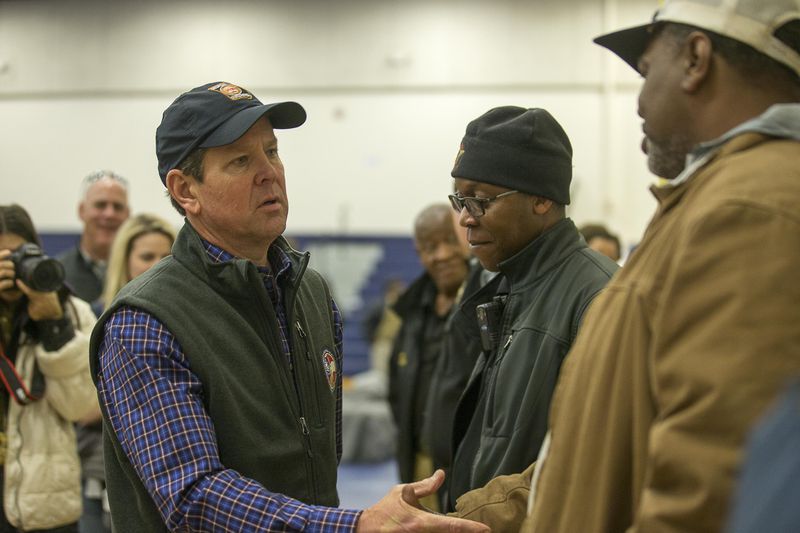 03/04/2019 -- Talbotton, Georgia -- Georgia Governor Brian Kemp speaks with individuals following a press conference at Central High school after surveying storm damage in Talbotton, Monday, March  4, 2019. Keith Stellman, head forecaster for the National Weather Service, said during the presser that the path of destruction in the town looked to be caused by an EF2 tornado, although that wasn't confirmed during the governor's tour.  (ALYSSA POINTER/ALYSSA.POINTER@AJC.COM)