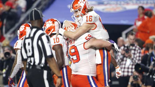Trevor Lawrence #16 of the Clemson Tigers is congratulated by his teammate Gage Cervenka after his 67-yard touchdown run against the Ohio State Buckeyes. (Photo by Ralph Freso/Getty Images)