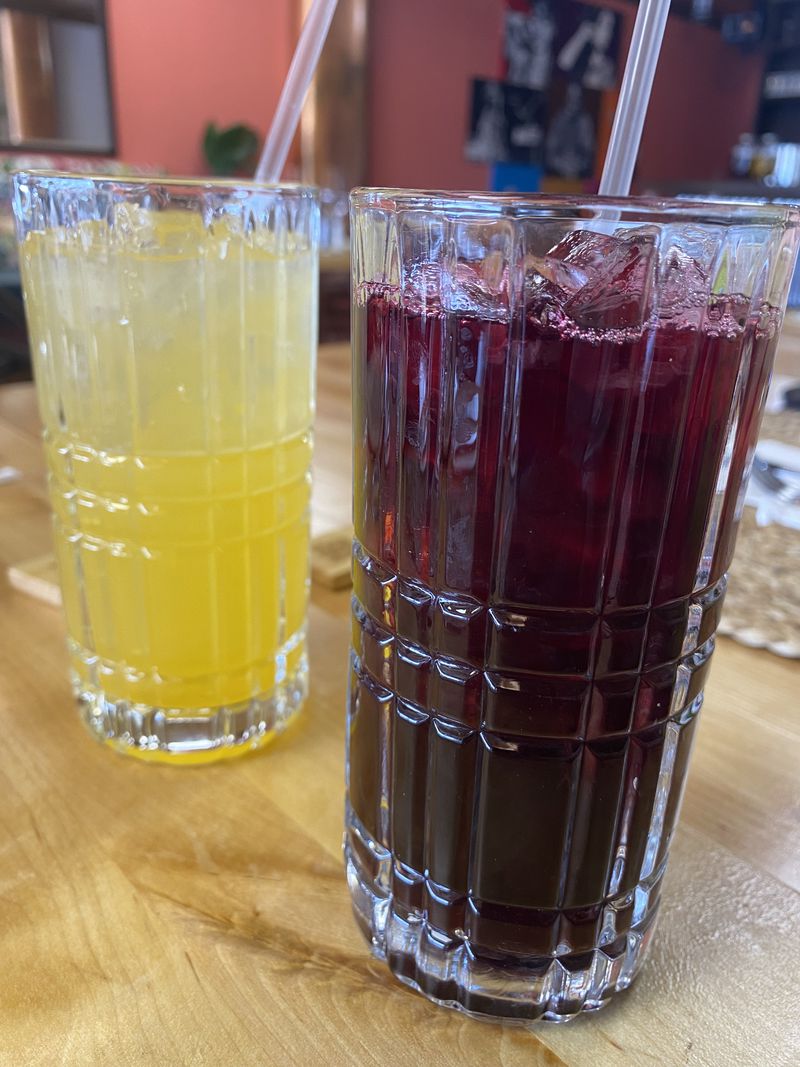 Belle & Lily's offers refreshing nonalcoholic drinks, such as a peach lemonade and sorrel. The latter also is used in a hibiscus mimosa. Ligaya Figueras/ligaya.figueras@ajc.com