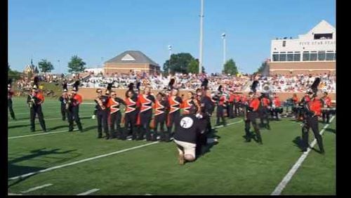 A Mercer band major from Marietta was surprised by her Alpharetta boyfriend's proposal at halftime on the football field.