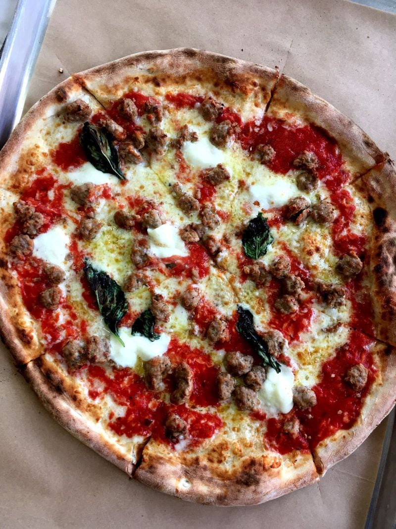 Aliño Pizzeria in the Mall of Georgia churns out classically styled Neapolitan pizzas. Our choice is the Toscana, with sausage, San Marzano tomato sauce, buffalo mozzarella, basil leaves, and garlic. CONTRIBUTED BY WYATT WILLIAMS