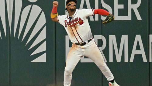Braves right fielder Ronald Acuna Jr. celebrates after catching a fly ball by the Mets' Jeff McNeil to end game at Truist Park on Sunday, Oct. 2, 2022. Atlanta Braves won 5-3 over New York Mets. (Hyosub Shin / Hyosub.Shin@ajc.com)