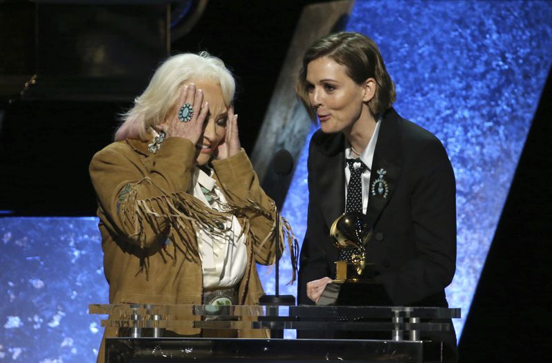 Tanya Tucker, left, and Brandi Carlile accept the award for best country song for "Bring My Flowers Now" at the 62nd annual Grammy Awards on Sunday, Jan. 26, 2020, in Los Angeles. (Photo by Matt Sayles/Invision/AP)