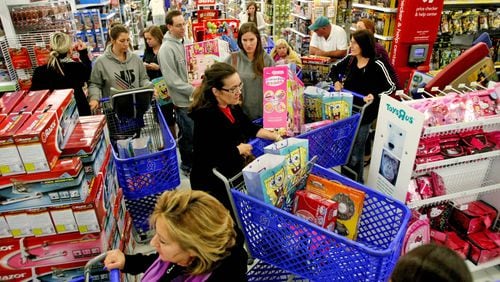 Shoppers in a shopping cart jam looking for 'Door Buster' Christmas deals at Toys "R" Us on Thanksgiving Day in Royal Palm Beach, Fla., Thursday, November 22, 2012. (Gary Coronado/The Palm Beach Post)