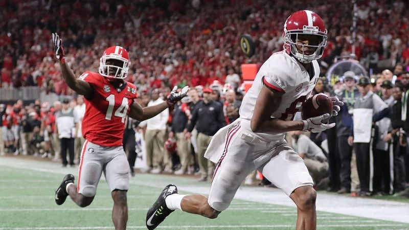 Alabama wide receiver Devonta Smith catches the game-winning touchdown pass past Georgia defensive back Malkom Parrish in overtime at the College Football Playoff  Championship n Monday, January 8, 2018, in Atlanta.