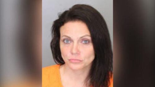 Dana Vela, 33, of Cordova, Tennessee, is accused of punching a police officer in the face and yelling racial slurs at him after being arrested Sunday.
