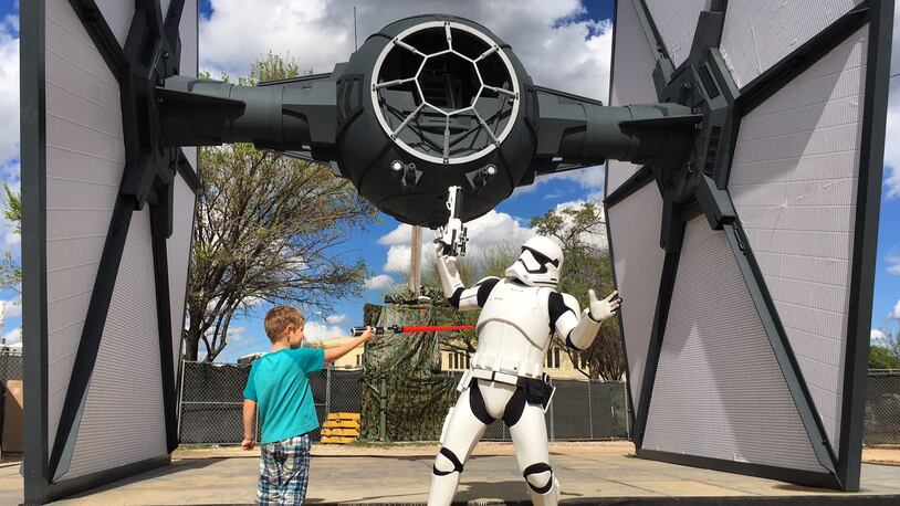 Jaden McClellan pretends to fight with a Star Wars storm trooper at SXSW 2016. The photo opportunity was part of a promotional event for the home video release of "Star Wars: The Force Awakens."