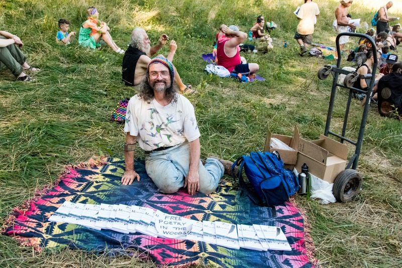 Poet Stephen Wing gave away copies of his book at the Rainbow Family of Living Light Gathering which took place for eth first time in Georgia at Chattahoochee National Forest from july 1 to july 7, 2018. (Cynthia Herms/CynthiaHerms.com)