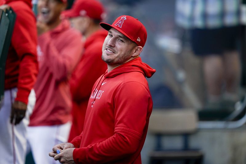 Los Angeles Angels center fielder Mike Trout stands in the dugout before a baseball game against the Philadelphia Phillies, Tuesday, April 30, 2024, in Anaheim, Calif. (AP Photo/Ryan Sun)