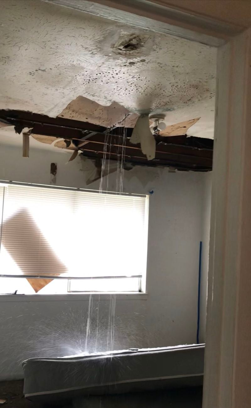 Pictured is an image of water falling from the ceiling in Angela McCoy's apartment earlier this week. McCoy said her apartment is so severely damaged that she’s been unable to continue living in the unit. She’s been staying with her mother and friends, she said. Courtesy Angela McCoy