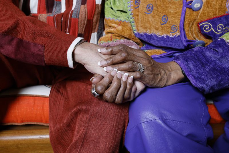 Morocco and Paula Coleman hold hands showing the love they have shared for decades. Miguel Martinez / miguel.martinezjimenez@ajc.com
