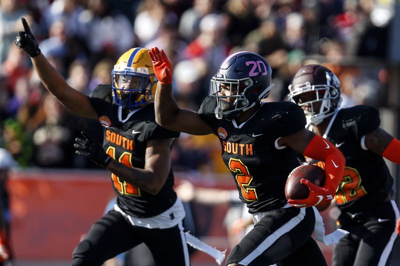 South cornerback Kindle Vildor of Georgia Southern (2) celebrates with South cornerback Dane Jackson of Pittsburgh (11) after intercepting a pass during the first half of the Senior Bowl college football game Saturday, Jan. 25, 2020, in Mobile, Ala. (AP Photo/Butch Dill)