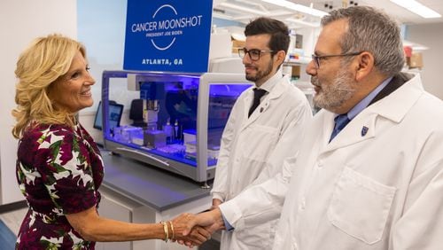 First Lady Jill Biden greets Professor Philip Santangelo during a tour of a scientific research laboratory at Emory University in Atlanta on Friday, September 15, 2023. The lab, which received a $24.8 million grant with partners at Yale, the University of Georgia and the company Transimmune as part of President Joe Biden’s “Cancer Moonshot” program, will study possible new ways to fight cancer and other diseases, using the immune system and mRNA technology. Standing beside them was José Assumpção, a postdoctoral fellow in Santangelo's lab. (Arvin Temkar / arvin.temkar@ajc.com)