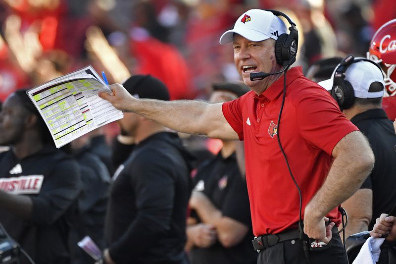 FILE - Louisville head coach Jeff Brohm shouts instructions to his team during the first half of an NCAA college football game in Louisville, Ky., Saturday, Sept. 23, 2023. Louisville enters without Jack Plummer, who led Jeff Brohm's first-year program to its first ACC title game berth. (AP Photo/Timothy D. Easley, FIle)