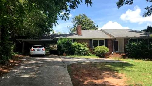 A house and land at 650 Hammond Drive, Sandy Springs, is being sold for $410,000 to the city, which plans to eventually demolish it for a widening of the street. CITY OF SANDY SPRINGS