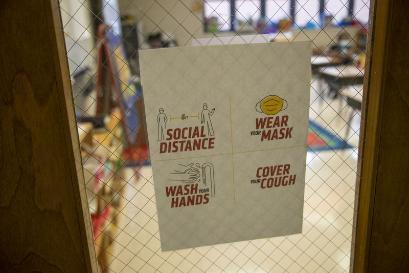 File photo from Social distancing and mask protocols posted on the door of a classroom during the Atlanta Public Schools Summer Academic Recovery Academy at Cascade Elementary School in Atlanta.  (Alyssa Pointer / Alyssa.Pointer@ajc.com)