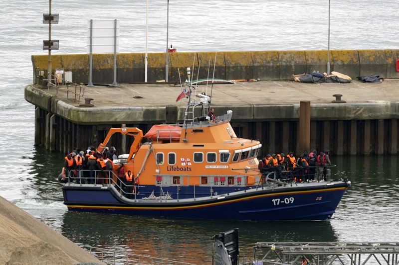 A group of people thought to be migrants are brought in to Dover, Kent, by the Border Force following a small boat incident in the Channel, on Tuesday April 23, 2024. Prime Minister Rishi Sunak said "nothing will stand in our way" of getting flights to Rwanda off the ground, as the Government braced itself for legal challenges to the scheme to send asylum seekers to the east African country. (Gareth Fuller/PA via AP)