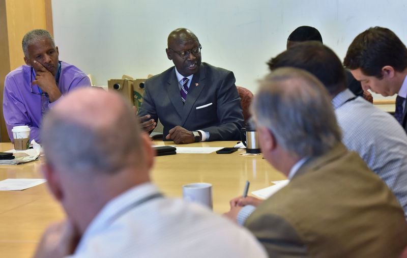 Roosevelt Council, (center), general manager at Hartsfield-Jackson International, leads a weekly meeting on the airport’s $6 billion long-range expansion program. HYOSUB SHIN / HSHIN@AJC.COM