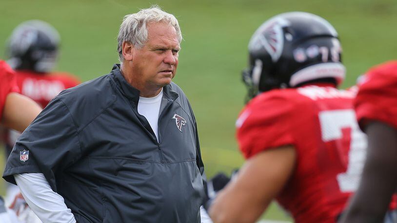 Falcons defensive coordinator Richard Smith watches over the defensive unit during team practice on Tuesday, August, 18, 2015, in Flowery Branch.