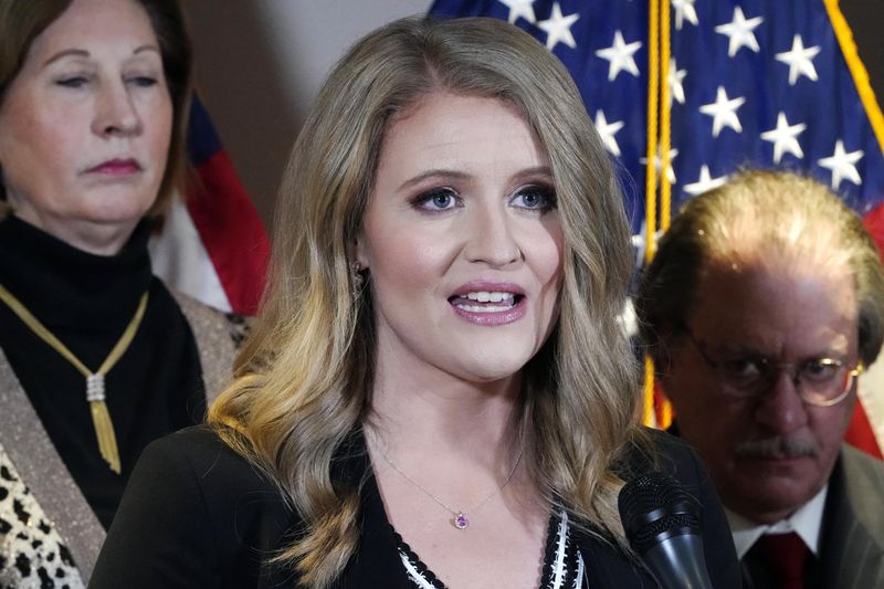 FILE - Jenna Ellis, a member of President Donald Trump's legal team, speaks during a news conference at the Republican National Committee headquarters, Nov. 19, 2020, in Washington. The Arizona attorney general’s office released a copy of the indictment Friday, April 26, 2024, that revealed conspiracy, fraud and forgery charges were filed against former Trump aide Mike Roman and attorneys John Eastman, Christina Bobb, Boris Epshteyn and Jenna Ellis. The lawyers were accused of organizing an attempt to use fake documents to persuade Congress not to certify Joe Biden’s victory. (AP Photo/Jacquelyn Martin, File)