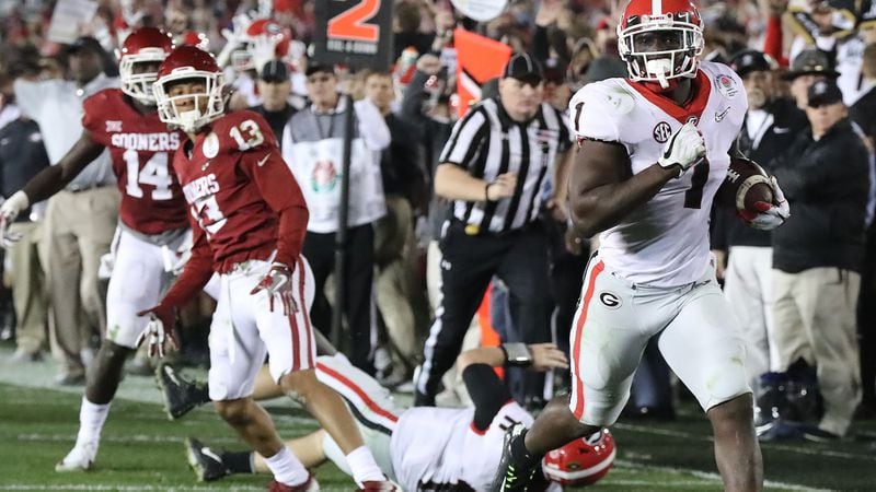Georgia tailback Sony Michel breaks away for a touchdown in the second overtime to beat Oklahoma, 54-48, in the Rose Bowl Monday, Jan. 1, 2018, in Pasadena, Calif.