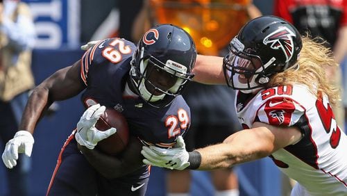 Chicago's Tarik Cohen avoids a tackle attempt by the Falcons' Brooks Reed during the season opening game at Soldier Field Sept. 10, 2017, in Chicago. The Falcons defeated the Bears 23-17.