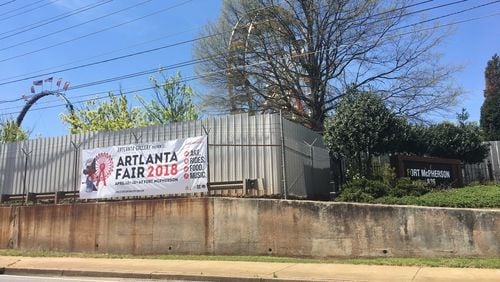 ARTlanta Fair rides can be seen behind the walls of Fort McPherson on April 11, 2018.