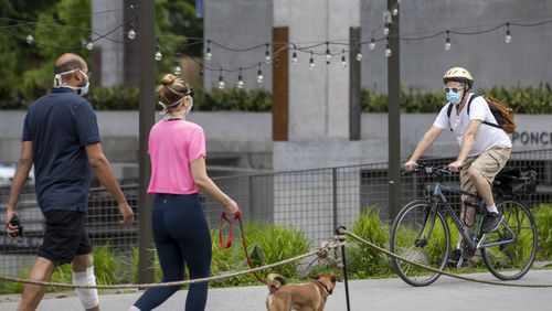 05/04/2020 - Atlanta, Georgia  - A bicyclist wears a face mask as he travels along the Atlanta BeltLine in the Old Fourth Ward community, Monday, May 4, 2020.  (ALYSSA POINTER / ALYSSA.POINTER@AJC.COM)