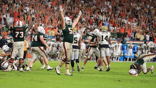 There's something familiar - Miami players celebrate Saturday after beating Georgia Tech, this time on a field goal with four seconds left. (Al Diaz/Miami Herald/TNS)