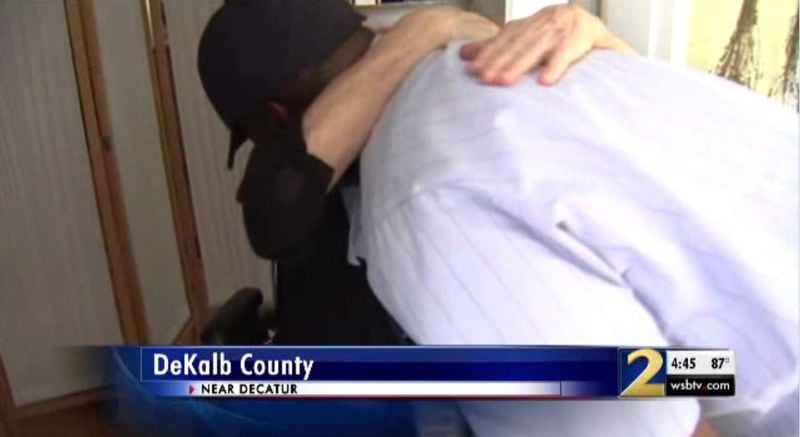 Mabel Walls, 79, hugs mail carrier Mark Palmer after he saved her life following a bad fall outside her DeKalb home.