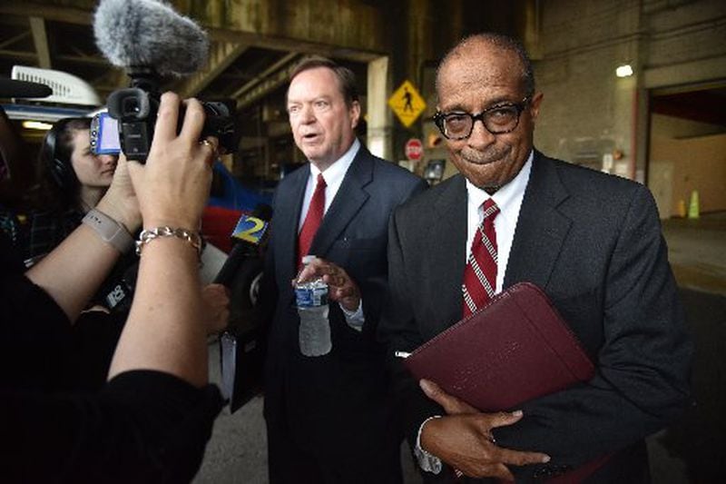 Elvin “E.R.” Mitchell Jr. (right) stands with his attorney, Craig Gillen, after Mitchell was sentenced for his role in Atlanta City Hall bribery. A brick was thrown through Mitchell’s window in an attempt to intimidate him, and stop his cooperating with the federal investigation. HYOSUB SHIN / HSHIN@AJC.COM