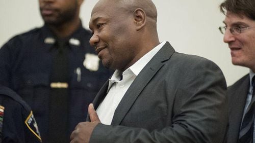 Derrick Hamilton, who served 21 years of a life sentence for murder, smiles during a news conference after his conviction was vacated Jan. 9, 2015, at Brooklyn Supreme Court in New York.