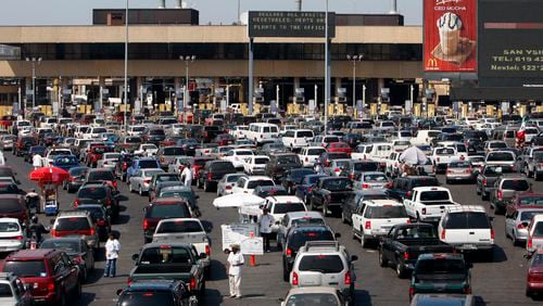 In this 2009 file photo, long lines of vehicles wait in line to enter the United States at the San Ysidro Border Crossing in San Diego, Calif. AP/Lenny Ignelzi
