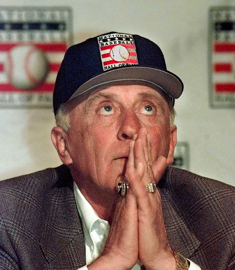 Phil Niekro holds his hands to his face during a New York news conference Tuesday, Jan. 7, 1997, after being voted into Baseball's Hall of Fame Monday. Niekro, who went through four years of eligibility without being voted into the Hall, said, 'Well, sometimes you wonder. I thought someday it was going to come.' (Kathy Willens/AP)