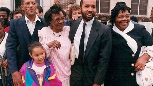Walter McMillian (from left), his granddaughter, his wife Minnie McMillian, attorney and author Bryan Stevenson and Walter's sister Evalene Smith gather outside the courthouse after Walter's release from prison. McMillian spent six years on death row for a murder he did not commit. Contributed by Equal Justice Initiative