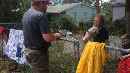 "Mama, you want a Chick-fil-A?" the Tybee police officer asked June Saunders when he went to check on her (and her Maltipoo Camee Rae) Tuesday afternoon. Saunders, whose son is on the force, wasn't actually sure what the nice young man's name was. "They all call me Mama," she said. Photo: Jennifer Brett, jbrett@ajc.com