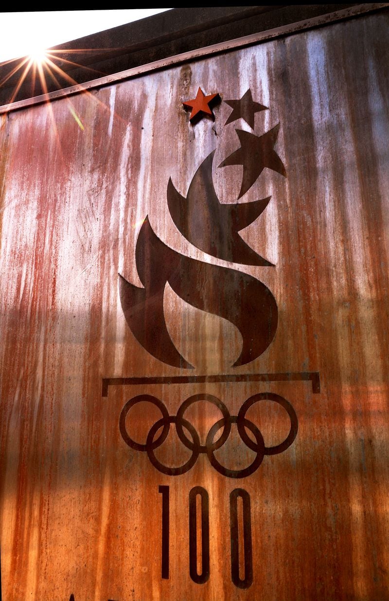 Rust eats away on a 1996 Atlanta Olympics plaque at the base of the Olympic cauldron tower after sunrise on Monday, Aug. 2, 2021, in Atlanta. Curtis Compton / Curtis.Compton@ajc.com