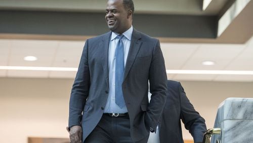 12/29/2017 — Atlanta, GA, - Atlanta mayor Kasim Reed smiles as people gathered in the atrium of Atlanta City Hall applaud him during his final workday as mayor of Atlanta, Friday, December 29, 2017. In addition to unveiling last minute decisions that he oversaw during his time as mayor of Atlanta, Kasim Reed also celebrated with food and a live dj in the auditorium of the building. ALYSSA POINTER/ALYSSA.POINTER@AJC.COM