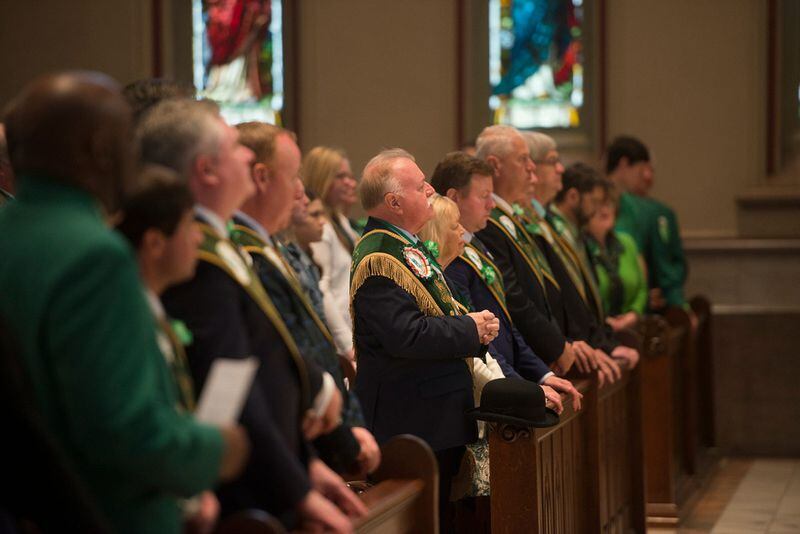St. Patrick's Day Parade Committee Grand Marshal George Schwarz, center, attends the St. Patrick's Day Mass at the Cathedral Basilica of St. John the Baptist.