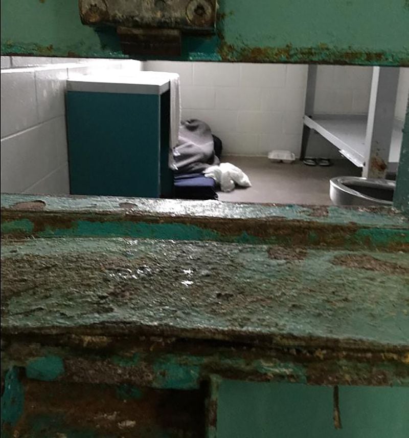 This corroded cell door flap — used to deliver food and medication to inmates — is typical of unhealthy conditions at the South Fulton Municipal Regional Jail, according to a federal lawsuit filed Wednesday, April 10, 2019, by the Georgia Advocacy Office and two women being held there. The lawsuit includes graphic photos from a recent visit to the jail — among them this one — and details unimaginable conditions for the women detainees.