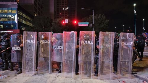 On May 29, 2020, in downtown Atlanta, after a peaceful march to the Georgia State Capitol that swelled into the hundreds, protesters returned to the area around Centennial Olympic Park and CNN Center, where some confronted police, who sprayed some demonstrators with pepper spray. Demonstrators expressed outrage over the death of George Floyd in Minneapolis. (Ben Gray for The Atlanta Journal-Constitution)