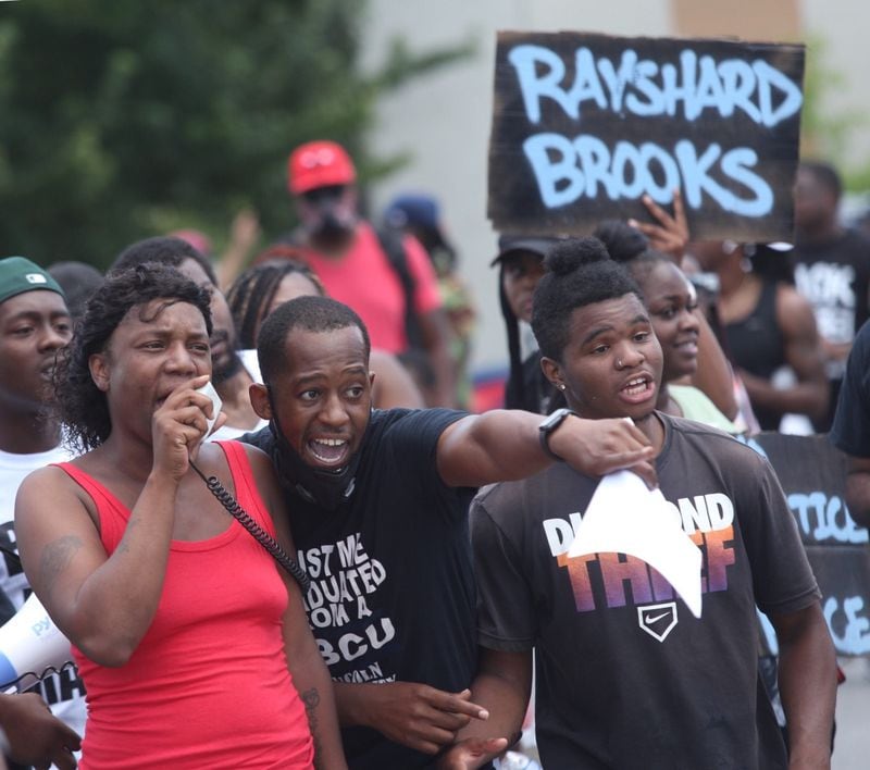 Protestors gather on University Avenue  near the Atlanta Wendy's where Rayshard Brooks, a 27-year-old black man,  was shot and killed by Atlanta police Friday evening during a struggle in a drive-thru line.  Steve Schaefer for the Atlanta Journal Constitution
