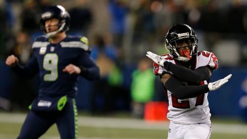 Atlanta Falcons' Damontae Kazee (27) reacts to a missed field goal as Seattle Seahawks holder Jon Ryan walks away at the end of the second half of an NFL football game, Monday, Nov. 20, 2017, in Seattle. The Falcons won 34-31. (AP Photo/Stephen Brashear)
