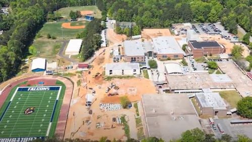 An aerial shot of the construction site at Pebblebrook High School. The Cobb County School District recently started its $48 million project to build a new classroom addition, gym and second theater at the school in Mableton. Credit: Cobb County School District